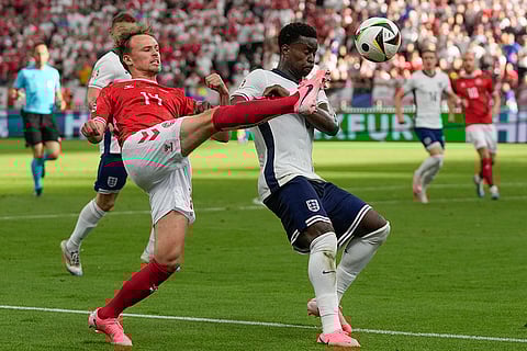 Marc Guehi and Mikkel Damsgaard fight for the ball